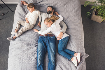 Wall Mural - family sleeping on bed