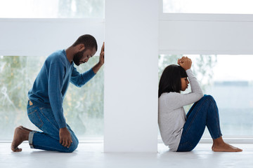 Wall Mural - Sad man regretting the quarrel with his girlfriend