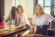 © Bojan - Portrait of unhappy teenage girl being gossiped about by peers.