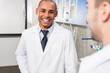 © LIGHTFIELD STUDIOS - african american doctor in lab coat