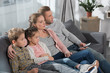 © LIGHTFIELD STUDIOS - Family watching TV