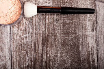 Poster - Professional cosmetics make up prducts in autumn concept on dark wooden background. Studio photo