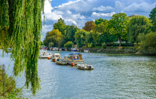 Fotografie, Obraz Moored boats on the river Thames in summer on a overcast day, Richmond London U