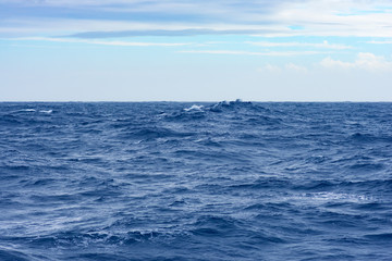 Clouds, waves and ship trace in Pacific