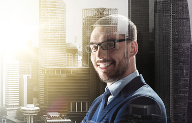 Sticker - smiling businessman in glasses over city buildings