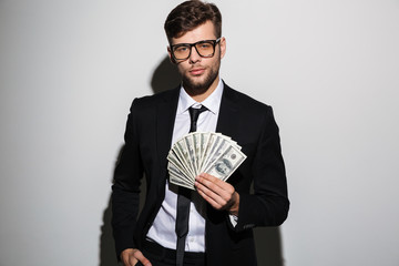 Canvas Print - Portrait of a confident successful man in suit and eyewear