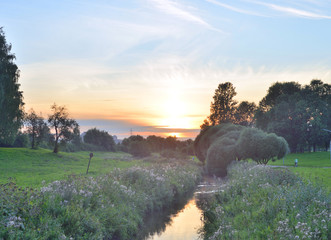 Wall Mural - Summer landscape at sunset.