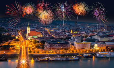fireworks over the old town in bratislava, new bridge over danube river with evening lights in capit