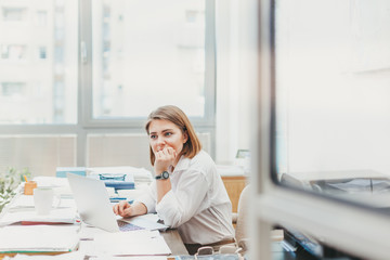 Wall Mural - Young business woman problem solving in the office