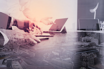 Poster - co working team meeting concept,businessman using smart phone and digital tablet and laptop computer in modern office with London city exposure
