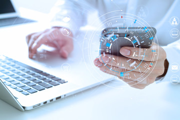Aufkleber - close up of businessman working with smart phone and digital tablet and laptop computer  on wooden desk in modern office with virtual icon diagram
