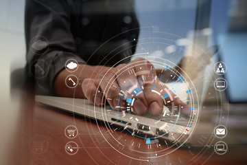Poster - businessman hand working with modern laptop computer in modern office with virtual icon diagram