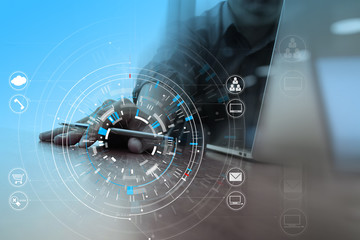 Poster - businessman hand working with modern laptop computer in modern office with virtual icon diagram