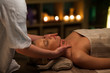 © Lumina/Stocksy - Woman receiving face massage at spa