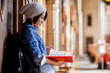 © aremafoto/Stocksy - Asian college student studying in the library