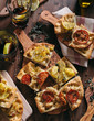 © Davide Illini/Stocksy - Italian Focaccia with potatoes and tomatoes