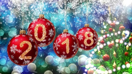 Wall Mural - red balls with numbers 2018 hanging on the background of a blue bokeh and a rotating christmas tree 