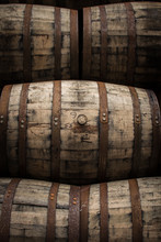 Wooden Barrels And Casks Sit In A Pile