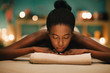 © Lumina/Stocksy - Woman relaxing on massage table at spa