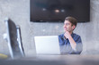 © .shock - businessman working using a laptop in startup office