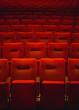 © Pixel Stories/Stocksy - Red theatre seats in rows
