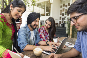 Group of Indian people are using computer laptop