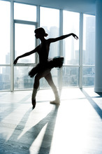 Ballerina In Silhouette In Front Of A Window