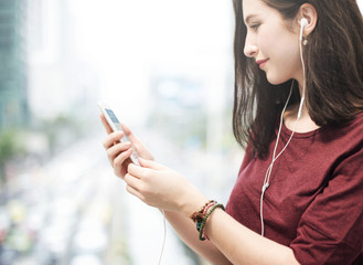 Poster - Young woman playing on her phone