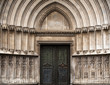 © Robert Kohlhuber/Stocksy - Church entrance in Girona, spain