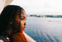 Black Girl Watching The Sea From A Cruise Ship Balcony