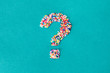 © Kathryn Swayze/Stocksy - The question mark symbol built from nonpareils