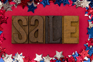 Canvas Print - Sale Spelled Out in Block Letters on an American Background