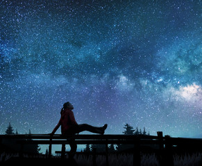 Wall Mural - girl watching the stars in night sky