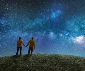 Wall Mural - couple in love watching the stars in night sky