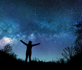 Wall Mural - girl watching the stars in night sky