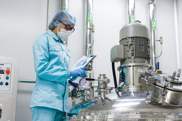 Wall Mural - scientist monitors the readings on the equipment