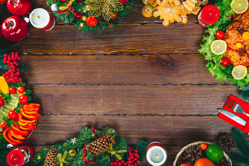 Christmas table dinner time with roasted meats decorated in Christmas style. Background thanksgiving. The concept of a family holiday, delicious food. Frame with free space