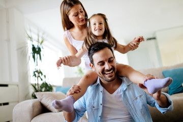 Wall Mural - Happy family having fun times at home