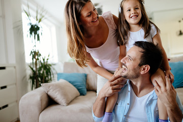 Wall Mural - Happy family having fun times at home