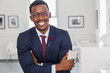 © Strauss/Curtis/Blend Images - Black man with arms crossed in gallery