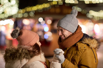 Poster - happy couple holding hands at christmas market