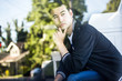 © Adam Hester/Blend Images - Pensive Chinese man sitting