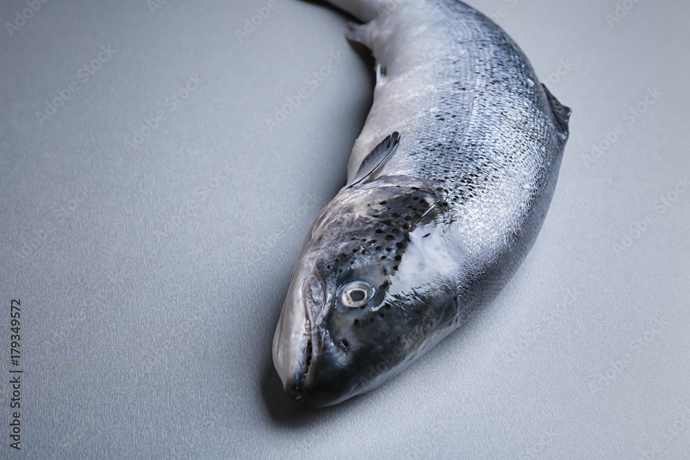 Fresh raw salmon on light background