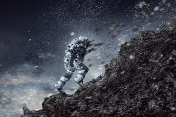 Wall Mural - Spaceman running fast. Mixed media