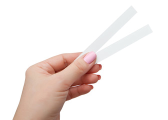 Female hand with two paper test strips for the perfume, isolated on white background