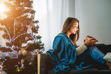 Christmas. Holidays magic. woman open her gift.