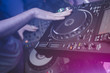 © juananbarros - Dj mixes the track in the nightclub at party