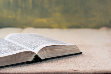 Bible on an old table. Beautiful background.Religion concept.