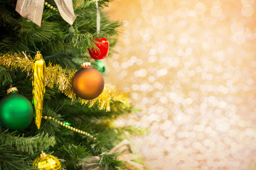 Wall Mural - Christmas tree with ornaments over golden background