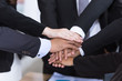 © wirojsid - Business teamwork concept hands stack join together